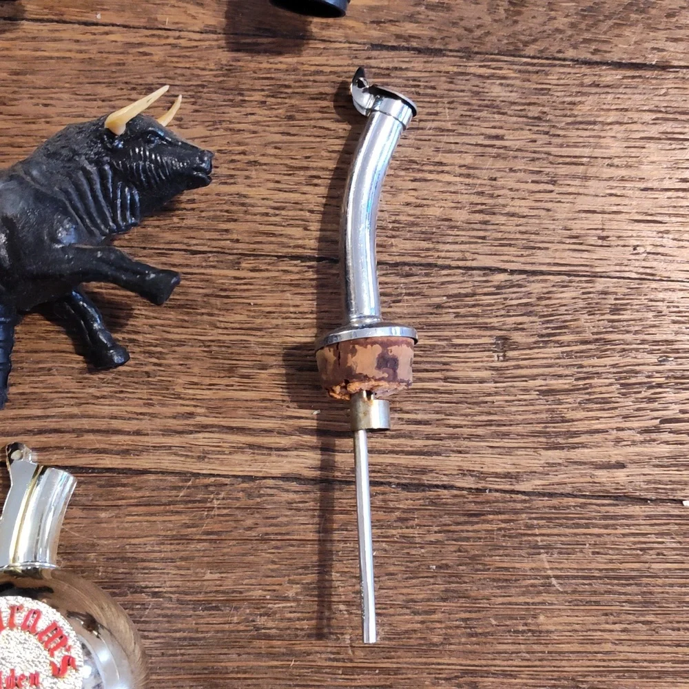 Lot Of vintage plastic bull head bottle pourer and stopper